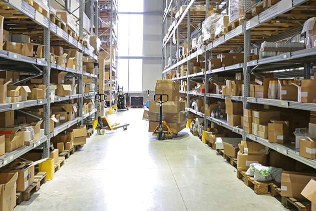 inside of a warehouse fulfillment center with forklift and shelves