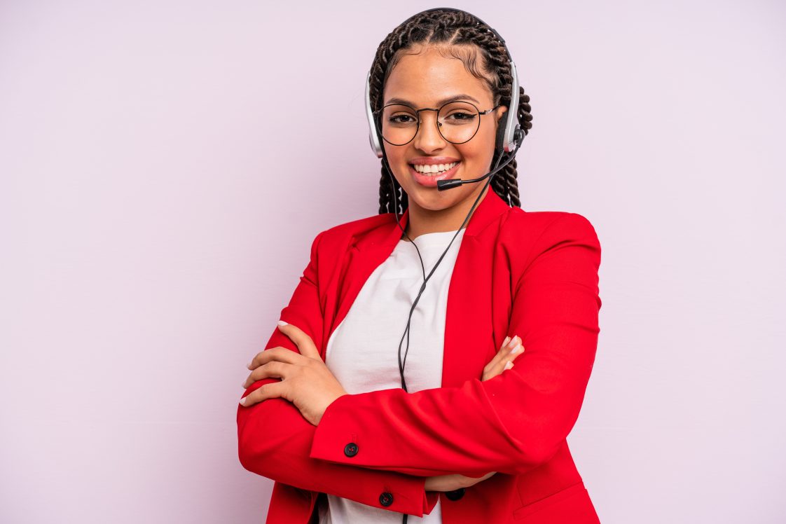 female customer care agent with headset smiling