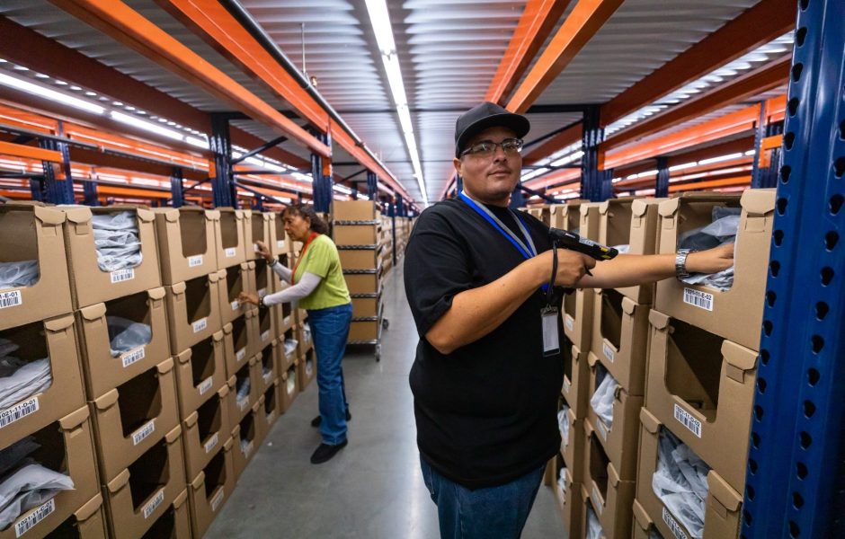 ecommerce fulfillment center worker scanning packages for order fulfillment