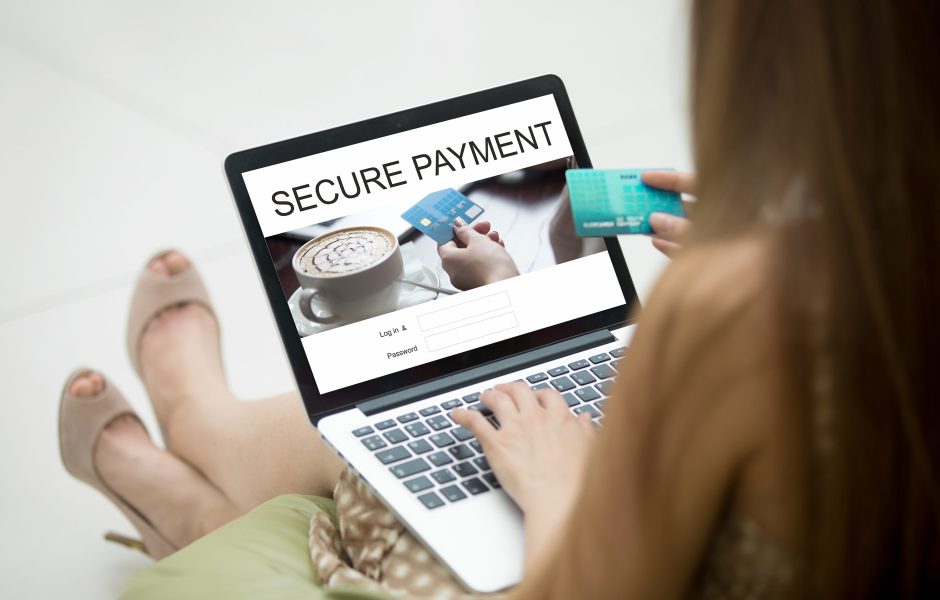 woman making a secure payment with a credit card online