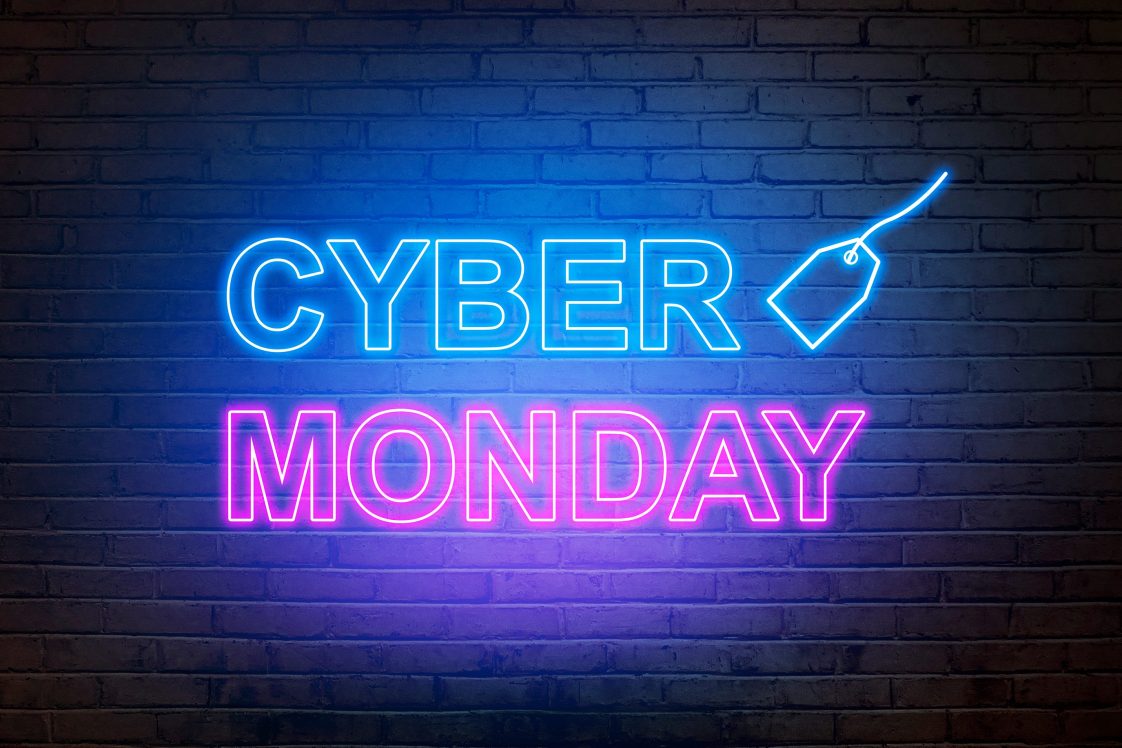 words cyber monday in. neon lights on brick wall