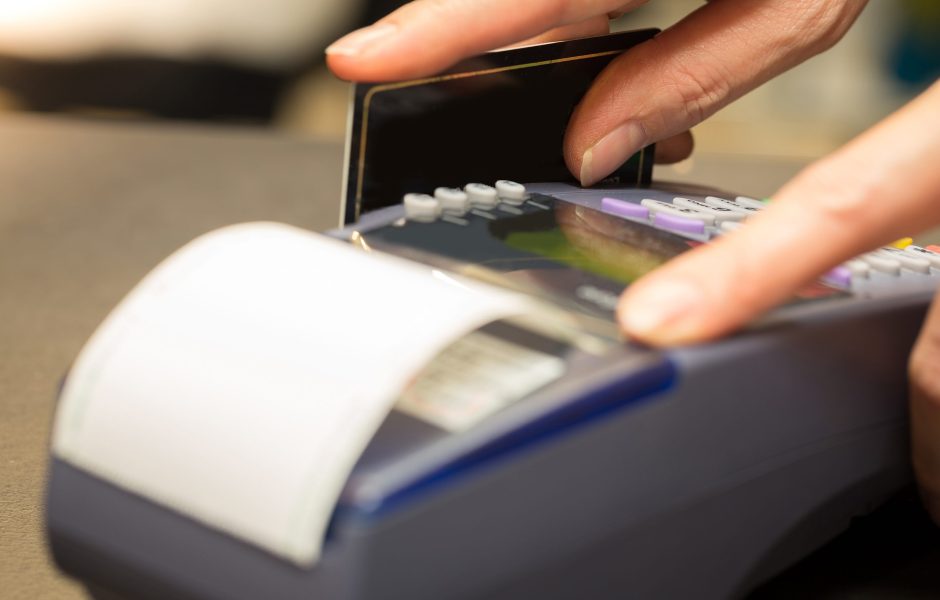 retailer store using credit card machine to check out customer