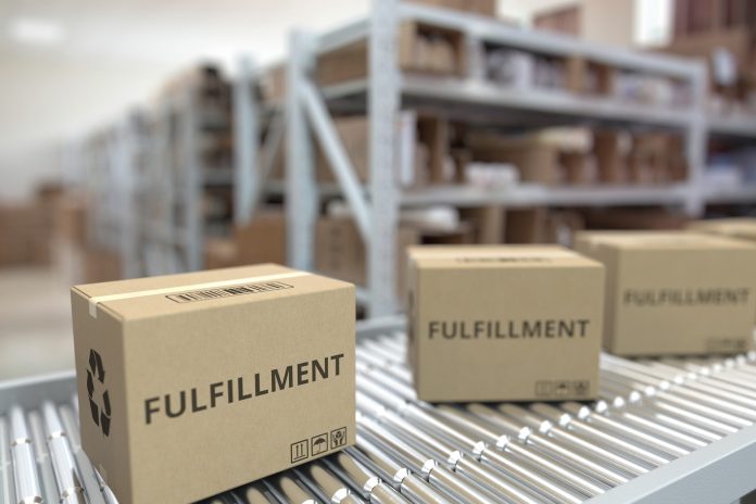 fulfillment boxes on conveyer belt in fulfillment center