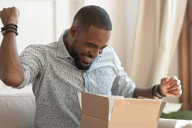 man opening package