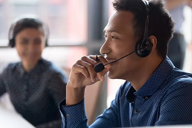 man in call center with headset on