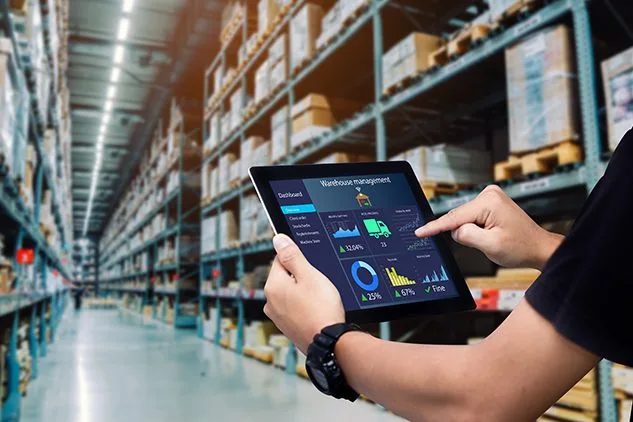 person using tablet in warehouse
