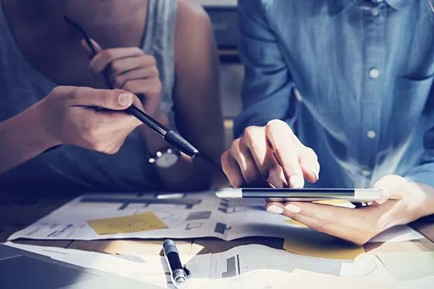 people using hand held tablet for business
