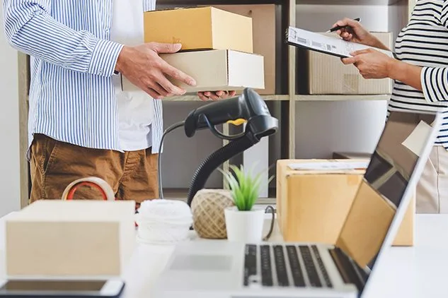 man holding boxes for in store pickup of something ordered