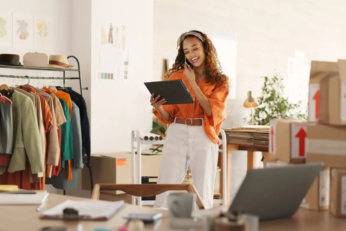 Ecommerce, small business and phone call, woman with tablet taking sales orders and checking inventory.