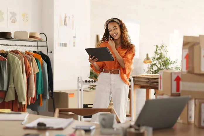 Ecommerce, small business and phone call, woman with tablet taking sales orders and checking inventory.